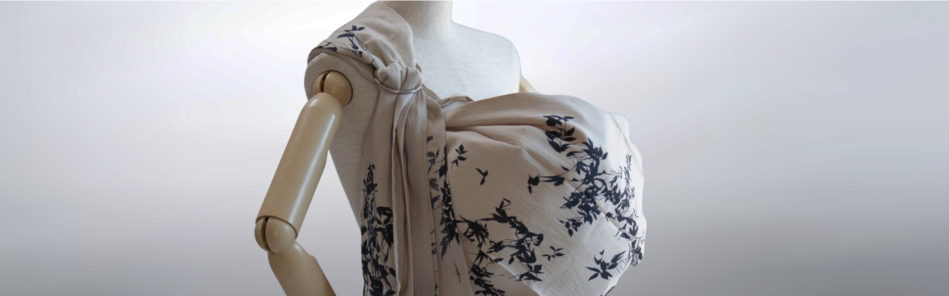 PsLing Avant Series ring sling in beige with bold black botanical pattern