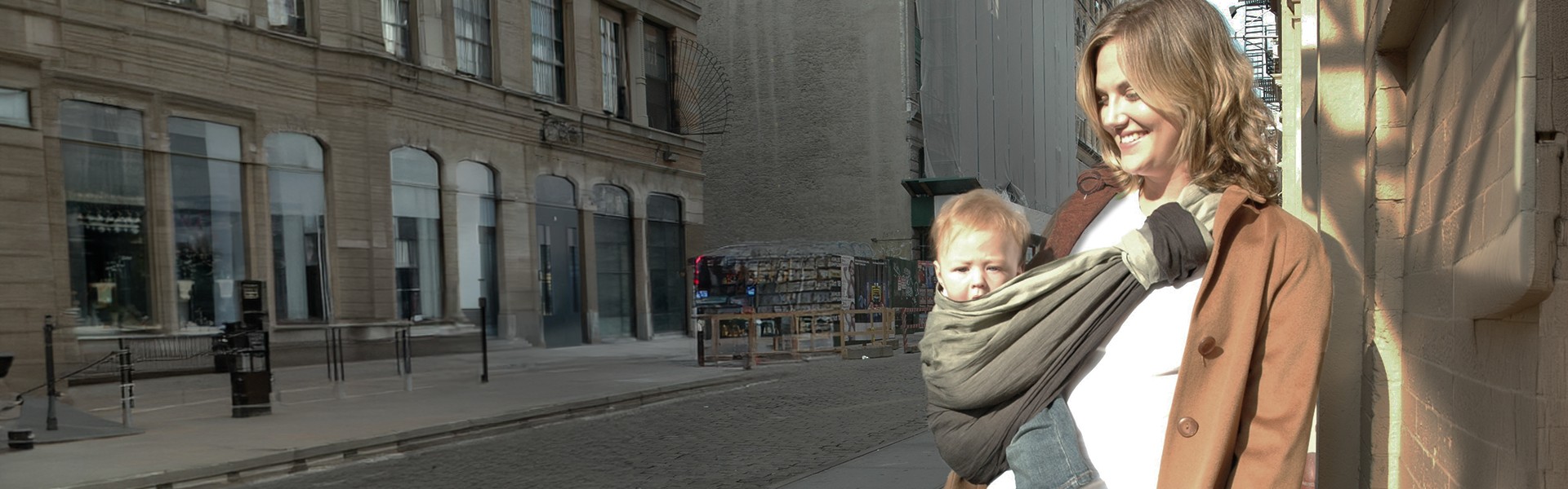 Mother carrying baby in ring sling on New York street – PsLing Gradient Series