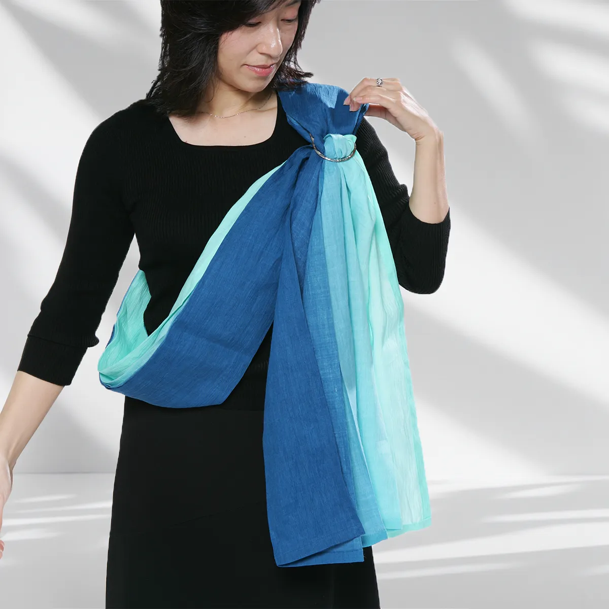 Step 07: Perfecting the Ring Placement. Position the rings high, nestled between your chest and shoulder. Proper height is the secret to a weightless carry and effortless adjustment later.