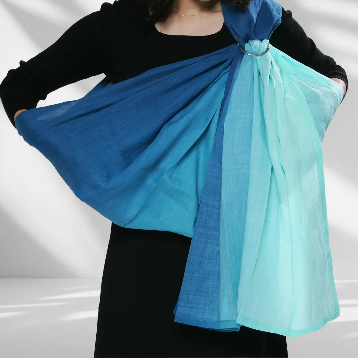 Step 08: Opening the Sanctuary. Gently expand the fabric to create a deep, supportive pouch. You have now created a secure sanctuary, ready to embrace your child's rhythm.