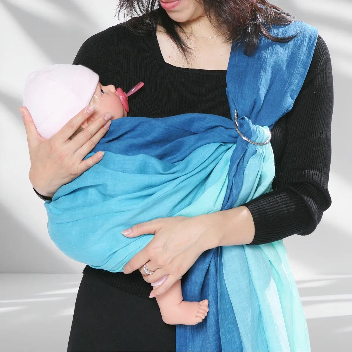 Step 15: Nursing in Privacy. After your baby's neck becomes stable, lower them slightly to a comfortable nursing height. The sling provides stable, hands-free support, letting you focus on the connection.